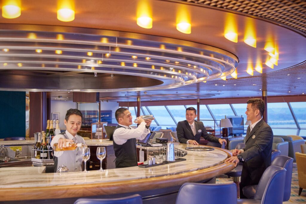 Cosy bar with ocean views on a cruise ship during a world cruise segment